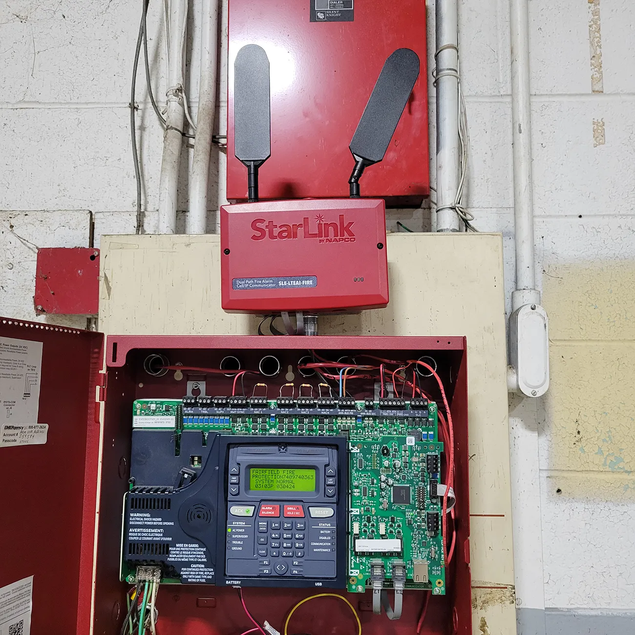 Fire alarm pull station being tested by Fairfield Fire Protection technician